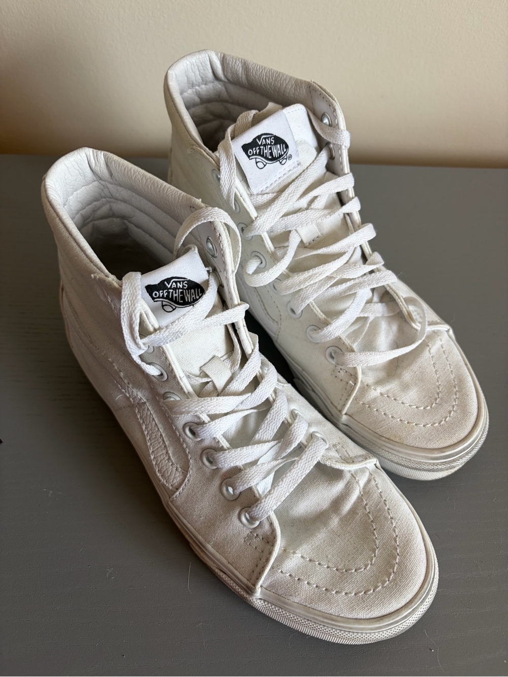 Vans womenโs High-Top Sneakers โ White